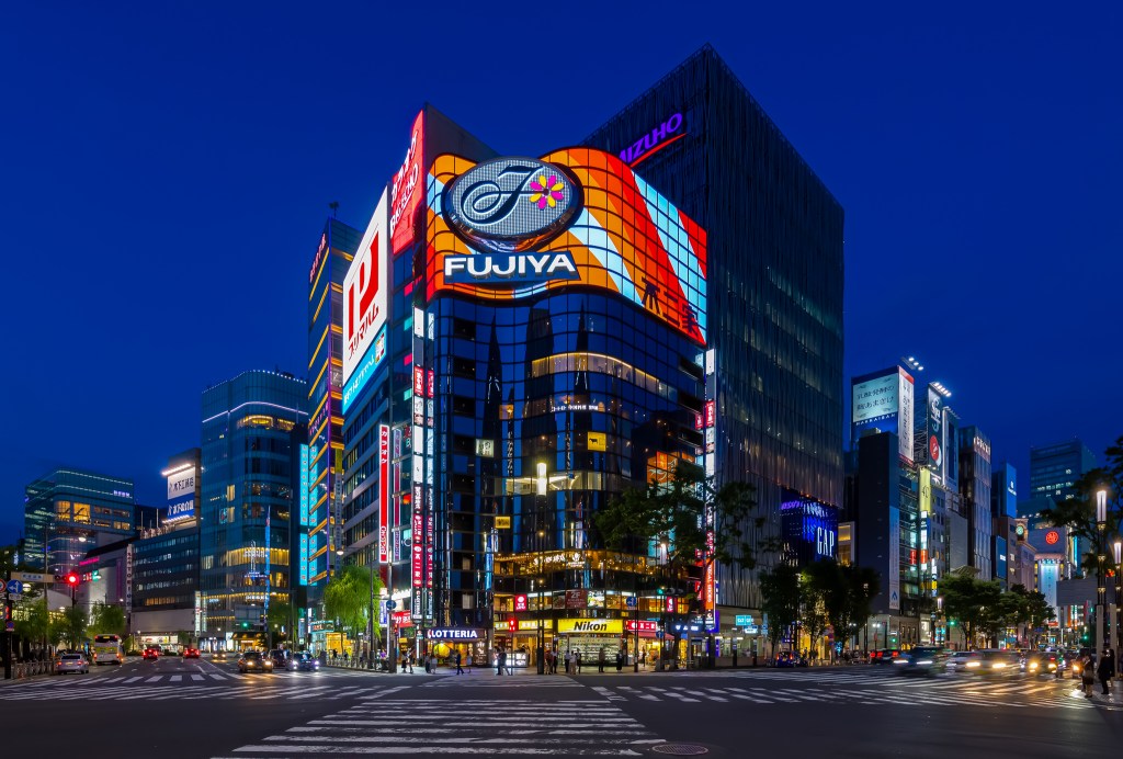 Illuminated street corner of Fujiya building at blue hour in Ginza, Tokyo